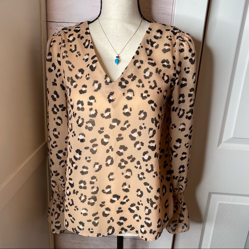 A new day leopard blouse, in good used condition.